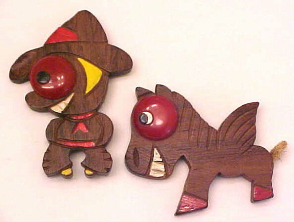 BP111 big bakelite eyed cowboy/horse pins